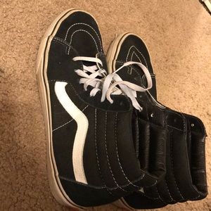 high top skate blacks and white old school vans.